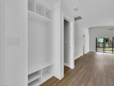 Custom Wainscoting & Catch-All In Foyer