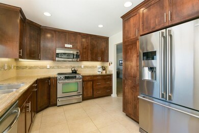 Gorgeous kitchen with custom cabinetry, granite co