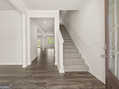 halton front entryway open foyer with access to the staircase and flex room