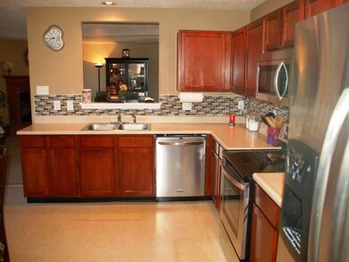 Kitchen. Updated Kitchen, Stainless Steel Apliances, Glass Backsplash, and pass thru to Living Room