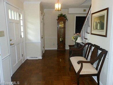 Entry. An inviting entry with warm, wood parquet flooring greets your guests! There are 2 handy coat closets.