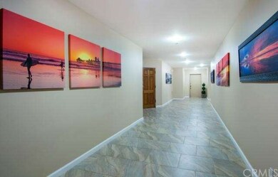 Entry corridor of building leading to condo (#102 