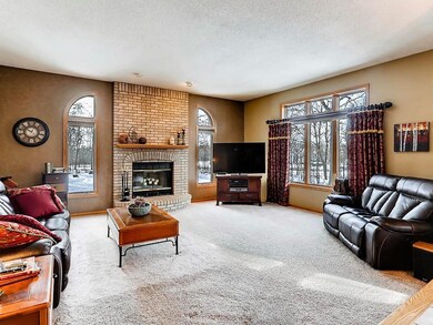 Great Room with fireplace and lovely windows overl