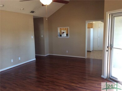 Living room looking into the kitchen.