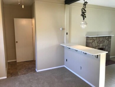 Breakfast bar overlooks living room.
