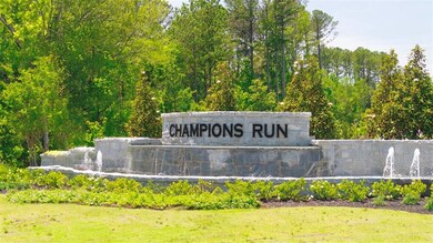 Community sign featuring a lawn