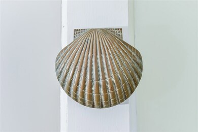 Shell knocker lends a beach house touch to this hi