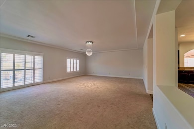 Unfurnished living room with carpet floors and bas