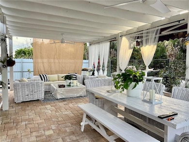 View of patio featuring outdoor dining area, an outdoor living space, and a ceiling fan