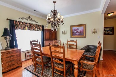 Formal Dining Area with crown molding & hardwoods
