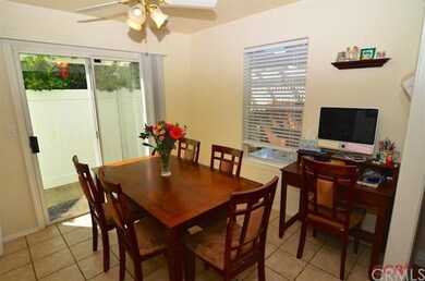 The dining area is open and airy with a sliding do