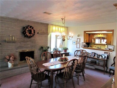 Cut stone wood burning fireplace.