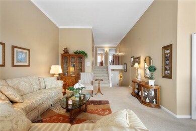 High ceilings add to the living room's spacious fe