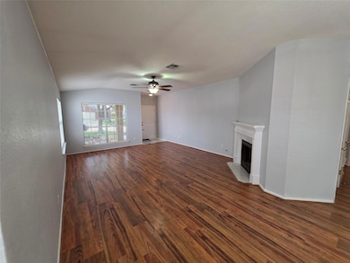 Unfurnished living room with wood finished floors