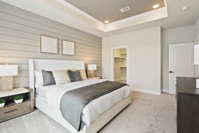 Relax in your spacious, modern bedroom, featuring