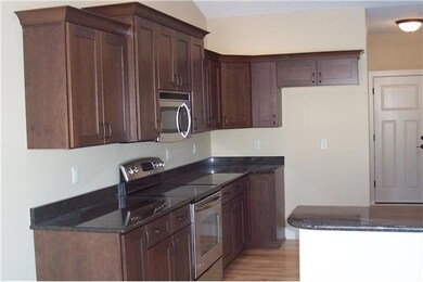Exterior Front. Stainless steel appliances.