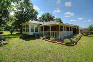 Front and left side of home. Wrap-around porch lea