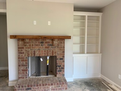 great room fireplace and built in cabine