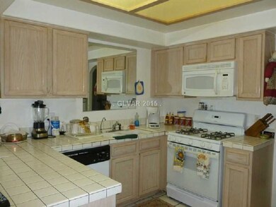 Property Photo. Kitchen with bar counter