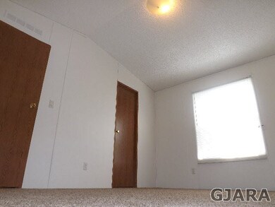 Master Bedroom in this home sits to the rear of ho