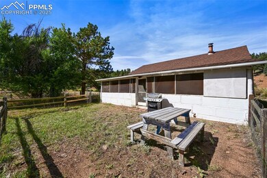 View of yard with fence and a sunroom