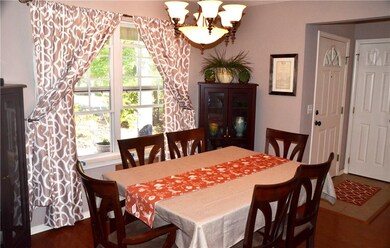 Formal Dining Room and part of the Entry Way to the right.