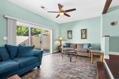 Living room featuring ceiling fan