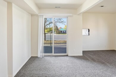 Carpeted empty room with baseboards