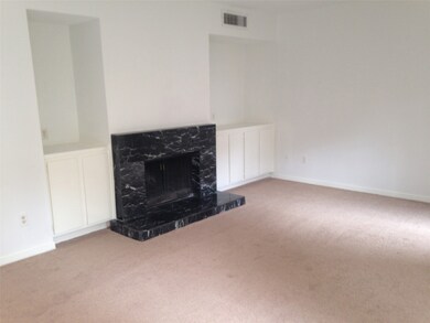 living room with wood burning F/P