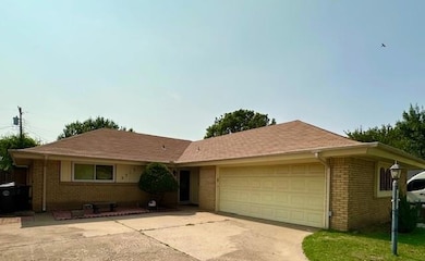 Single story home featuring a garage