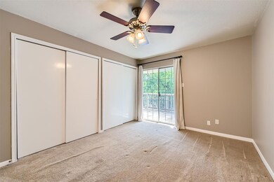 Unfurnished bedroom featuring access to outside, 