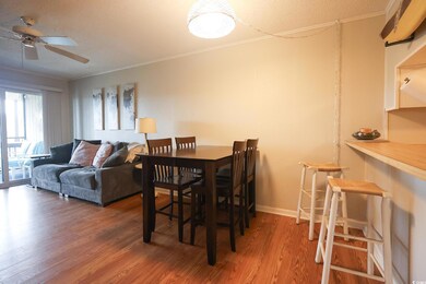 Dining area with crown molding, hardwood / wood-st
