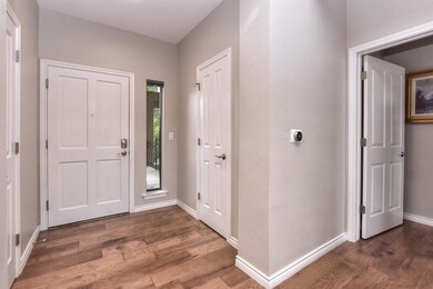 Foyer entrance featuring baseboards and wood fini
