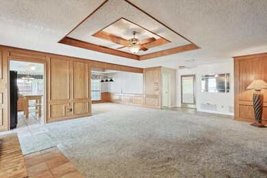 Unfurnished living room featuring a brick fireplac