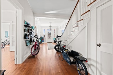 Entrance foyer featuring wood-type flooring, frenc