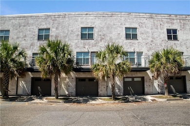 View of building exterior with an attached garage