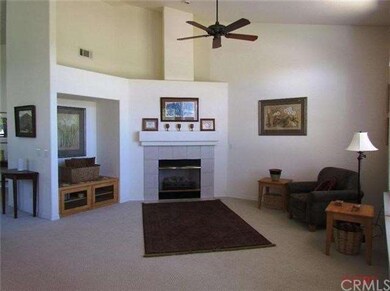 Family room with built in TV niche and tiled firep