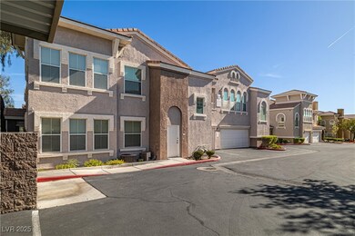 Townhome / multi-family property featuring a garag