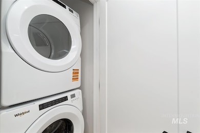 Washroom with estacked washer and dryer