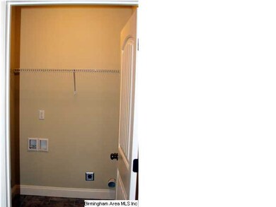 The laundry room is spacious and offers plenty of 