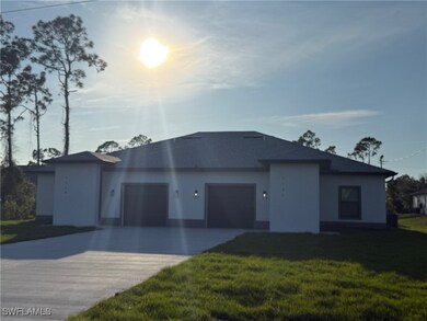 View of front of home with concrete driveway, an a