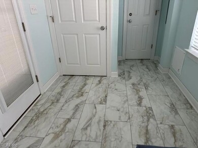 First floor entry w/half bath. New flooring.