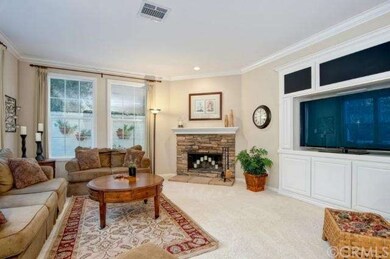 Spacious family room with custom built-ins, gas fi