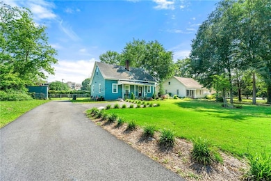 View of front of house featuring a chimney