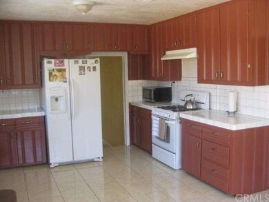 Another kitchen view with a doorway to the living 