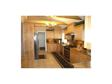 Huge kitchen with granite, maple cabinets, under c