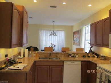 Kitchen facing breakfast bar and eating area