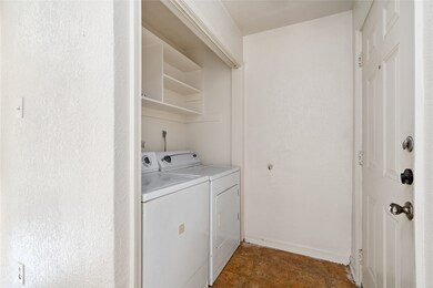 A convenient in-unit utility room equipped with a