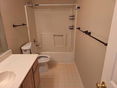 Full bathroom with tile patterned flooring, vanity