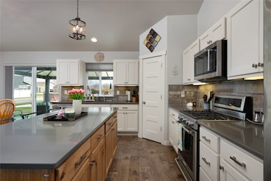 Bright, clean kitchen has water purifier and autom
